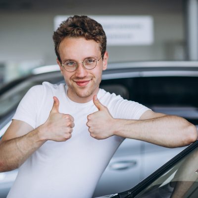 Man looking for a car in a car showroom